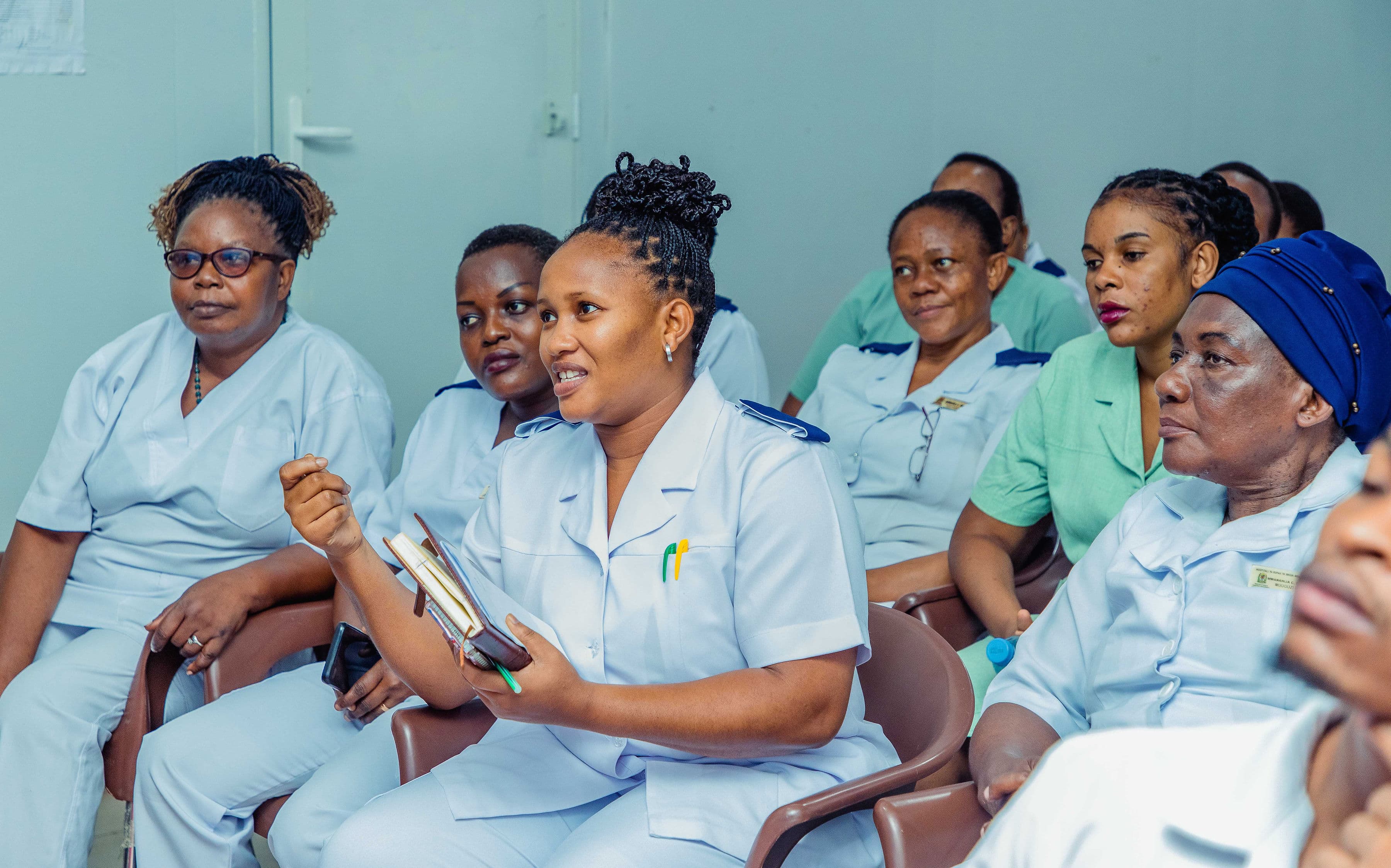 Healthcare workers receiving training on maternal and newborn care