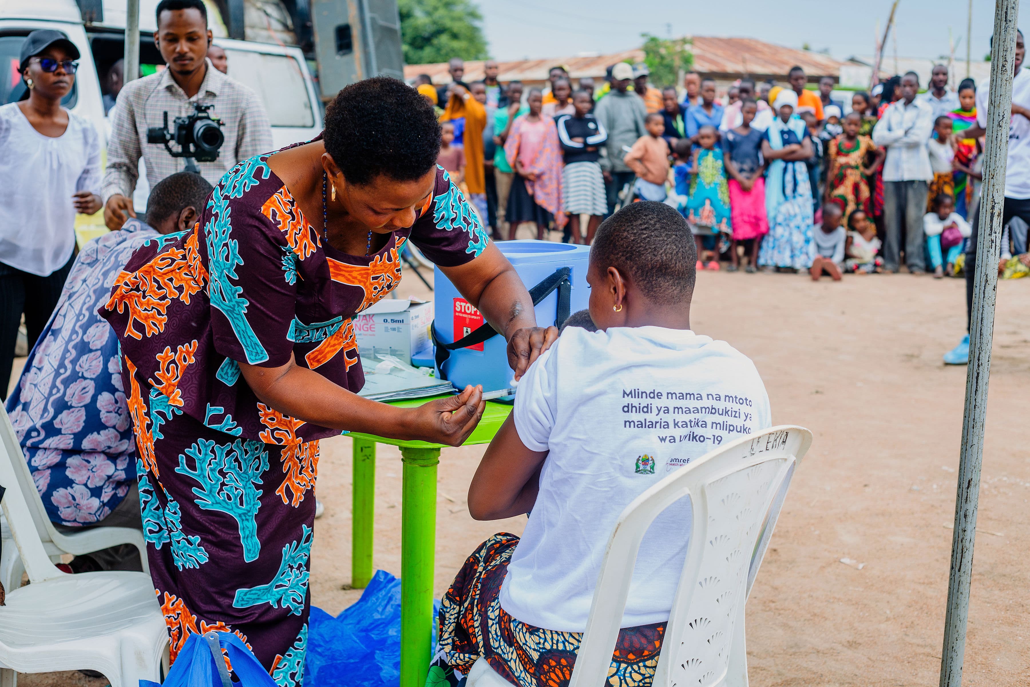 Pregnant and lactating mother receiving vaccination support during DMF COVID-19 response activities