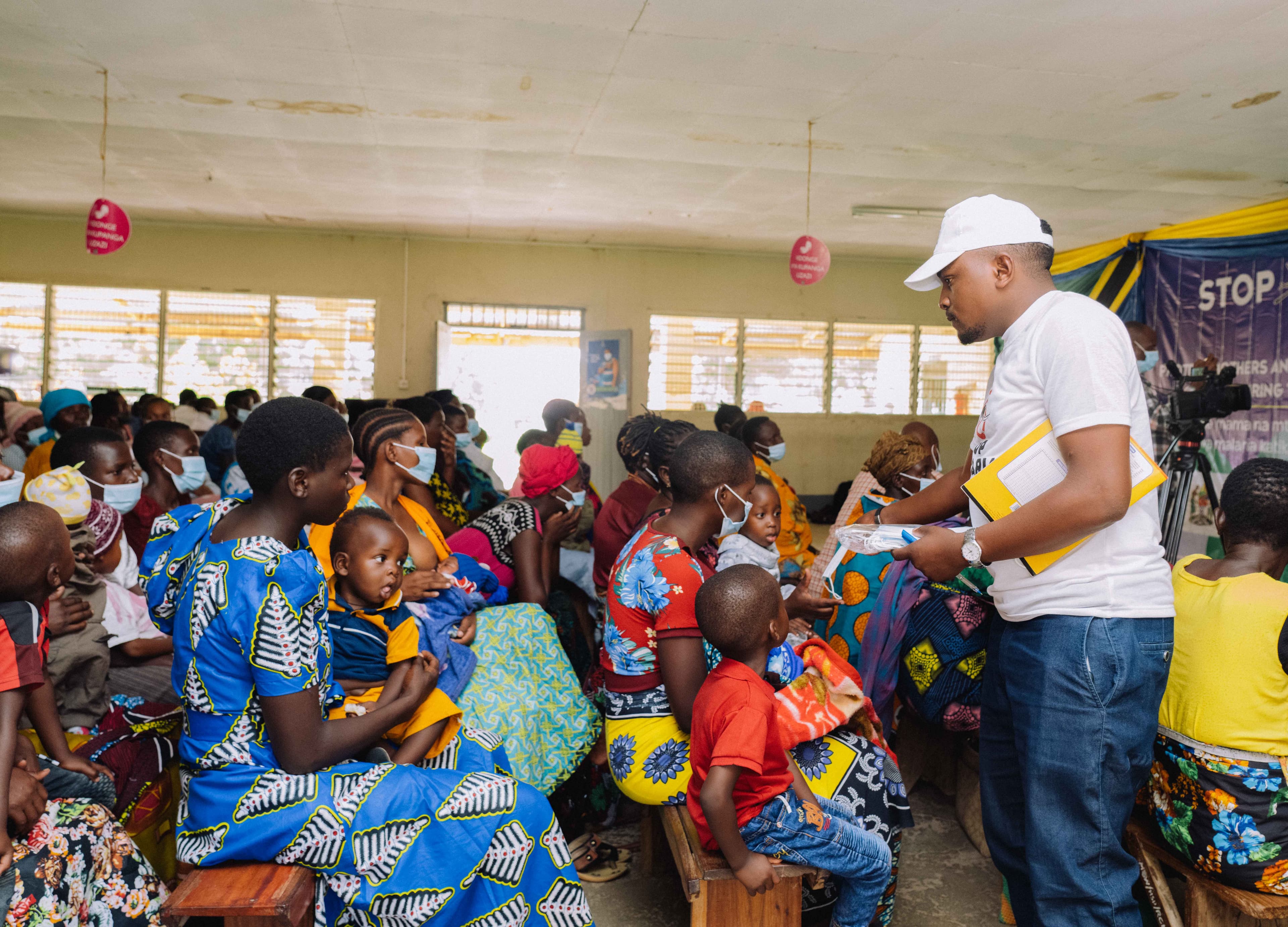 DMF community health outreach — distributing essential supplies to mothers and families